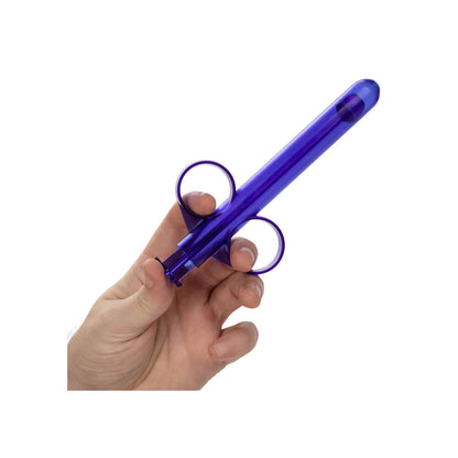 A person holding the California Exotic Admiral Lube Applicator