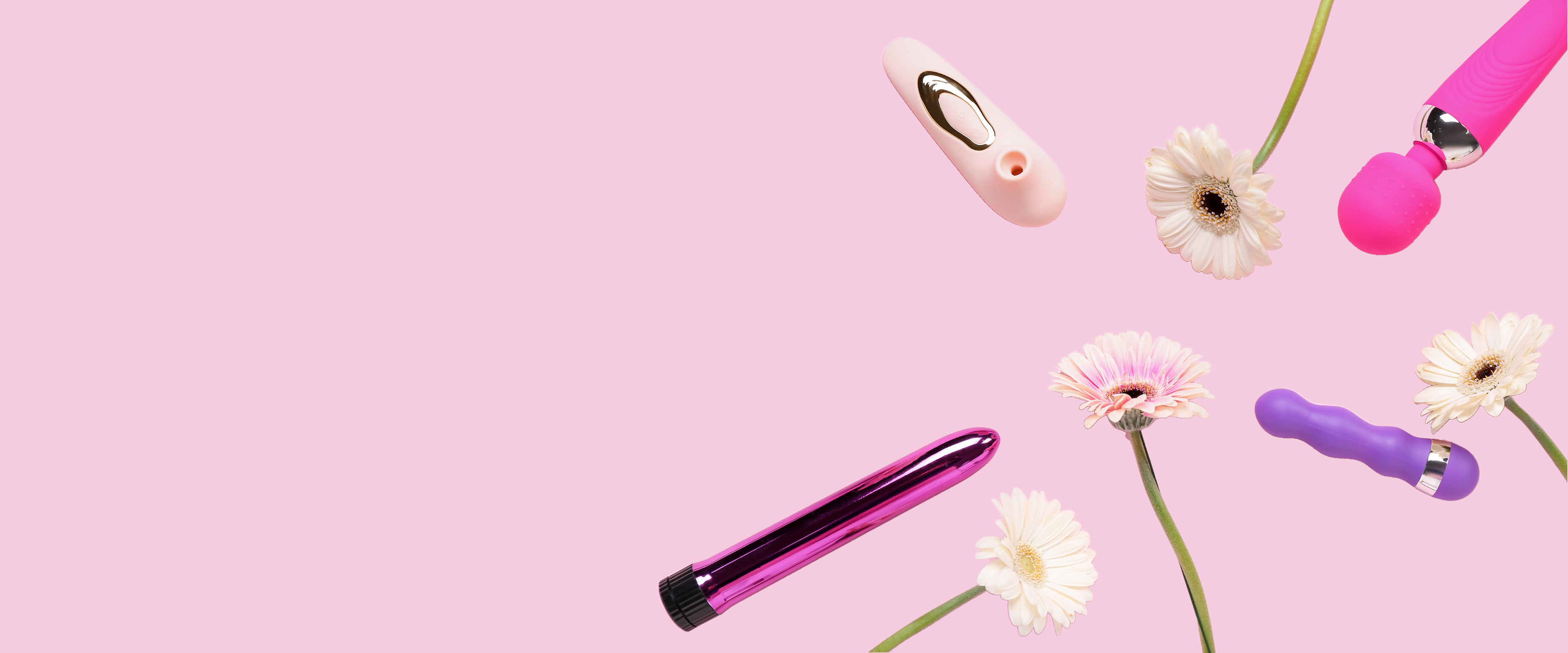 various sex toys and flowers on a pink background